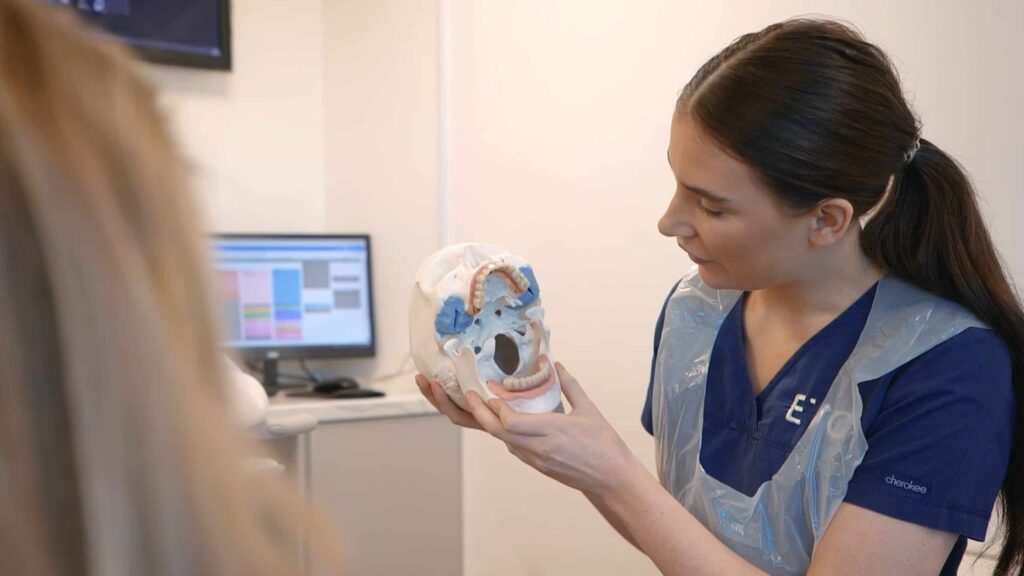 types of dental implants nurse speaking to patient