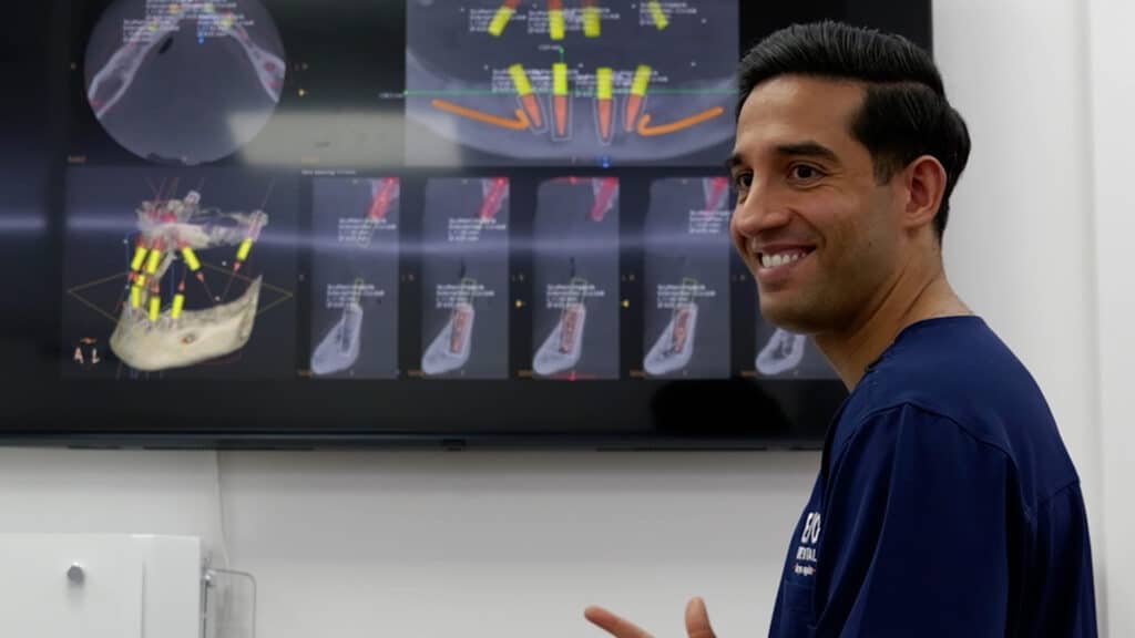 dentist smiling with screen